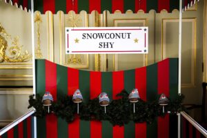 Christmas Coconut Shy Hire Fetcham Set up 1 scaled 1 300x200