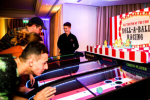 Roll a Ball Racing Fairground Game Hire Clownfish Events Host JC Woodlands scaled 2 300x200